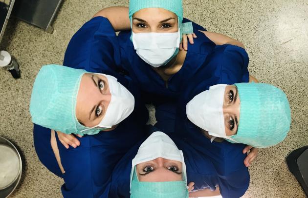 Trinity Gate Investments Interview with ELSAN, bird's eye view of a team of nurses hugging each other and looking towards us